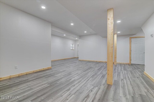 basement featuring light wood-type flooring