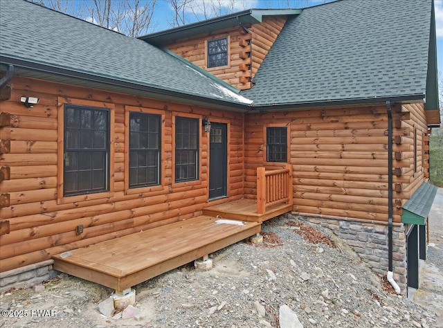 rear view of house featuring a deck