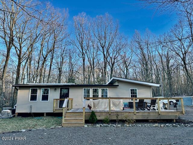 view of front of property with a wooden deck