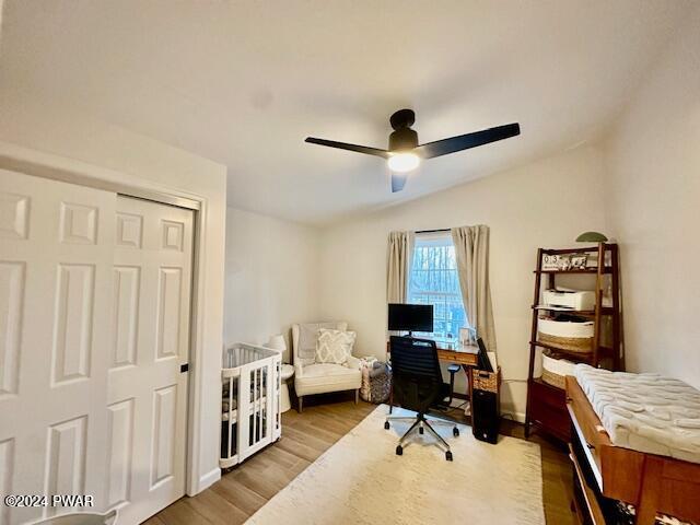 office area featuring hardwood / wood-style flooring, ceiling fan, and lofted ceiling