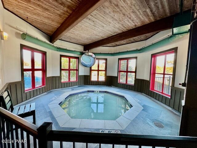 view of swimming pool featuring an indoor in ground hot tub