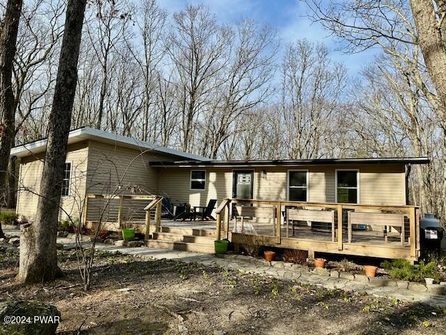 view of front of house with a wooden deck