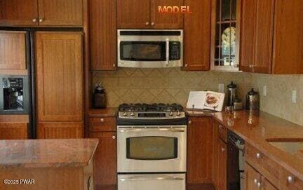 kitchen featuring tasteful backsplash and appliances with stainless steel finishes