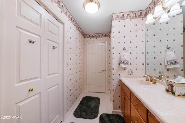 121 Island View Dr, Lake Ariel, PA 18436 - bathroom with wallpapered walls, vanity, baseboards, and tile patterned flooring