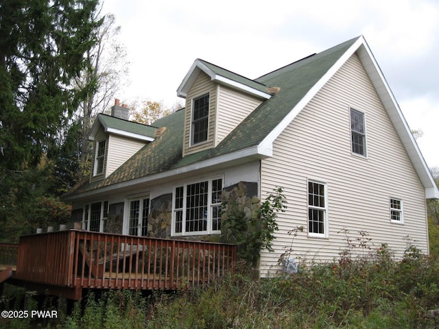 rear view of house with a wooden deck