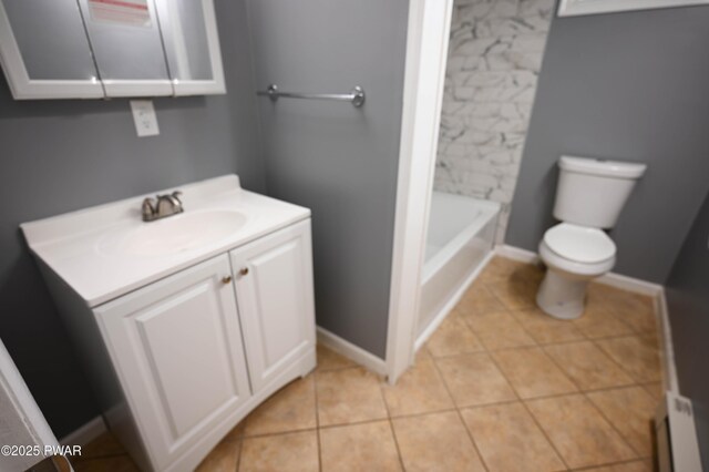 bathroom featuring vanity, tile patterned flooring, toilet, walk in shower, and a bathing tub