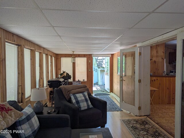 150 Shohola Pkwy N, Shohola, PA 18458 - living area featuring wooden walls, a drop ceiling, and light wood finished floors
