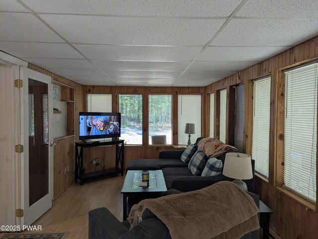 150 Shohola Pkwy N, Shohola, PA 18458 - living area featuring a paneled ceiling, wooden walls, and light wood-style floors