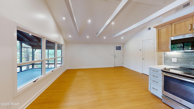 kitchen with light brown cabinets, light hardwood / wood-style flooring, vaulted ceiling with beams, appliances with stainless steel finishes, and tasteful backsplash