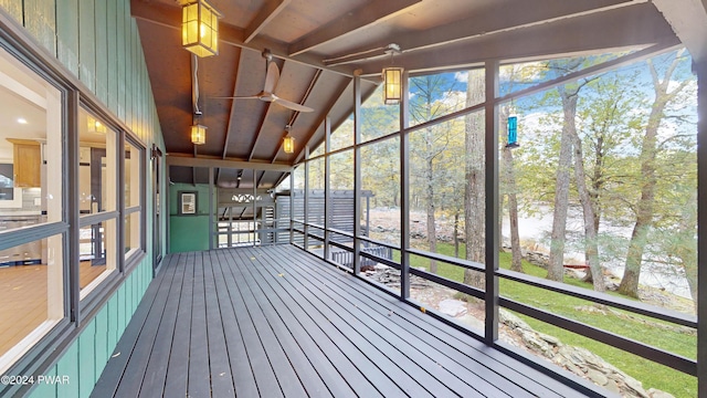 unfurnished sunroom with a wealth of natural light and vaulted ceiling