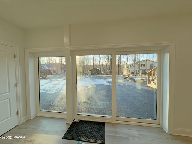 entryway with light hardwood / wood-style floors