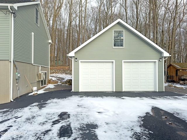 view of snow covered garage