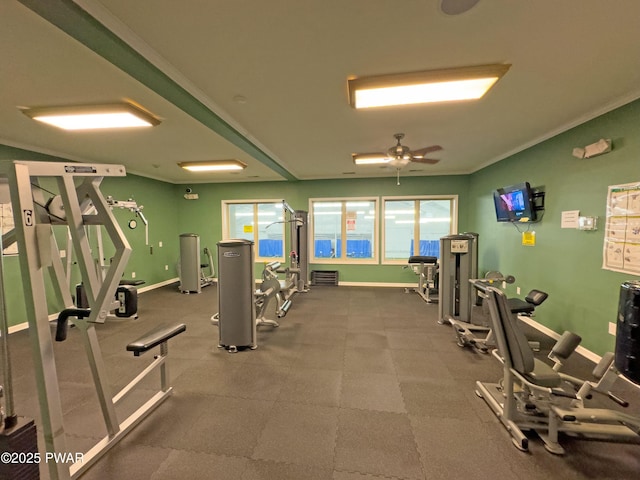 exercise room featuring ceiling fan, a wealth of natural light, and ornamental molding