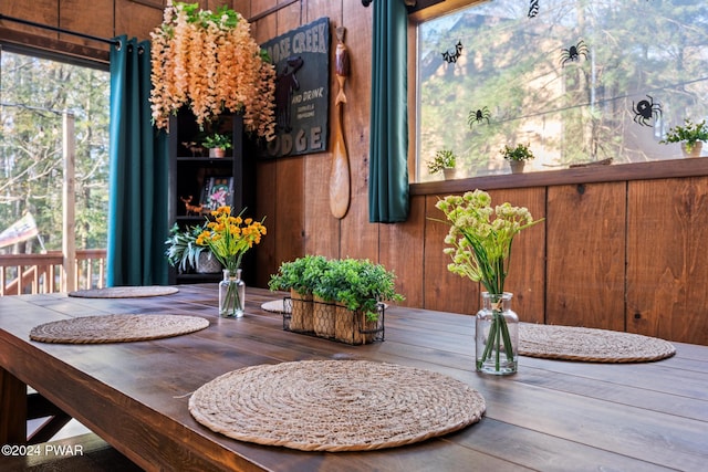 dining area with wood walls