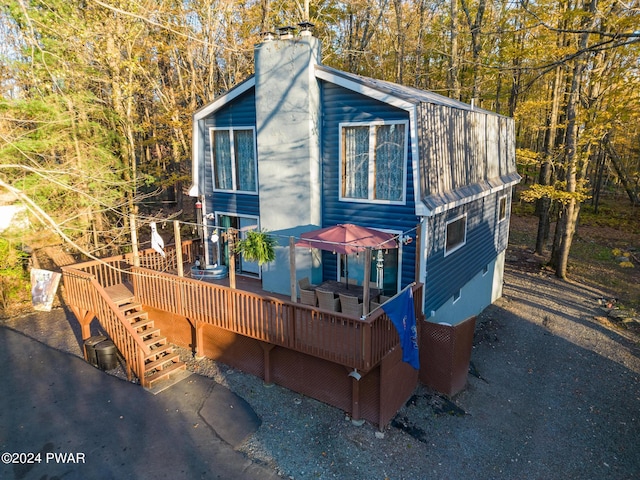 view of front of home featuring a wooden deck