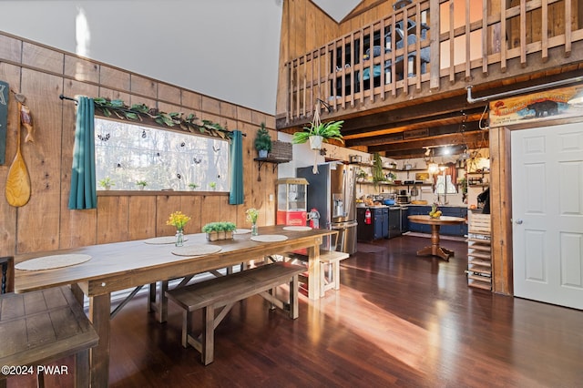 dining room featuring wooden walls and dark hardwood / wood-style floors