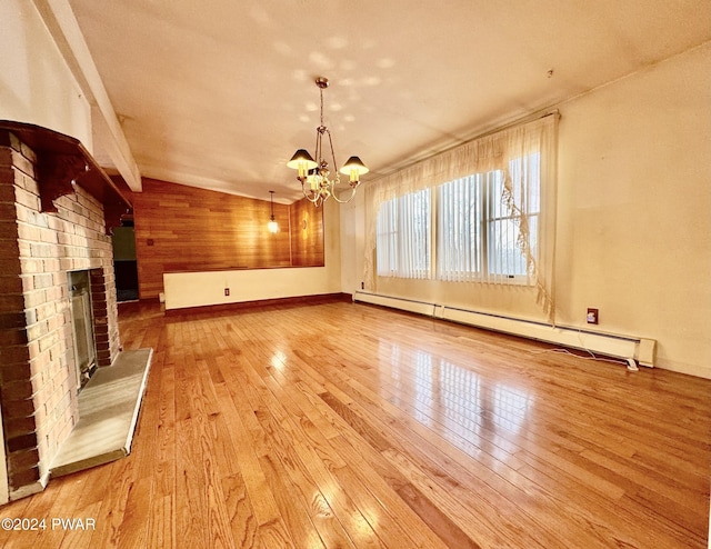 unfurnished living room featuring a chandelier, light hardwood / wood-style floors, a brick fireplace, and a baseboard heating unit