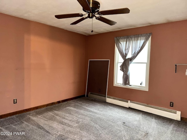 carpeted empty room with ceiling fan and a baseboard radiator