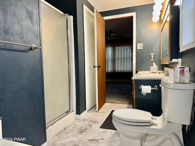 bathroom with vanity, a shower with shower door, and toilet