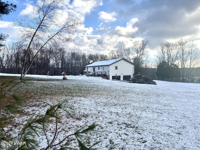 view of yard layered in snow