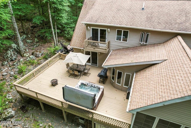 back of house with a wooden deck