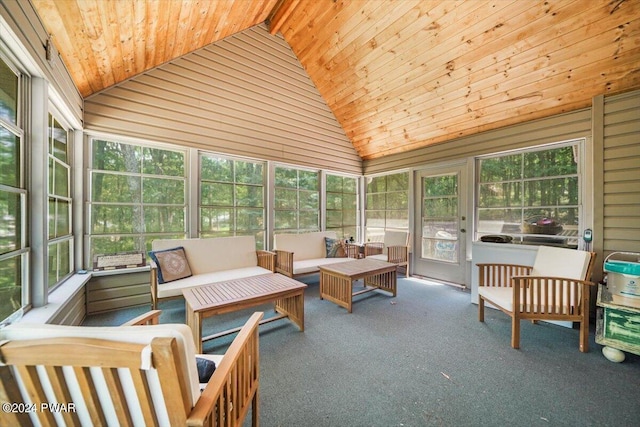 sunroom featuring vaulted ceiling and wooden ceiling