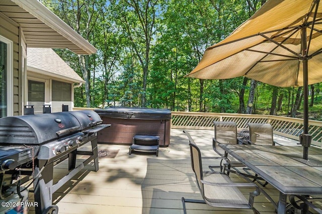 wooden deck featuring grilling area and a hot tub