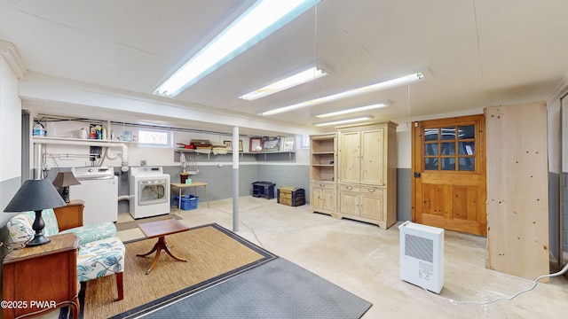 basement with washer and clothes dryer