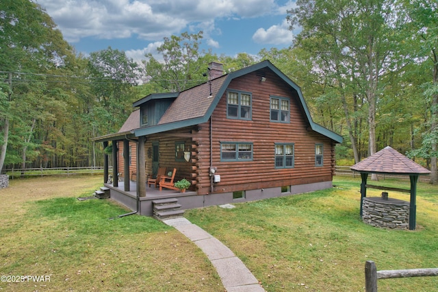 view of property exterior featuring a gazebo, a yard, and covered porch