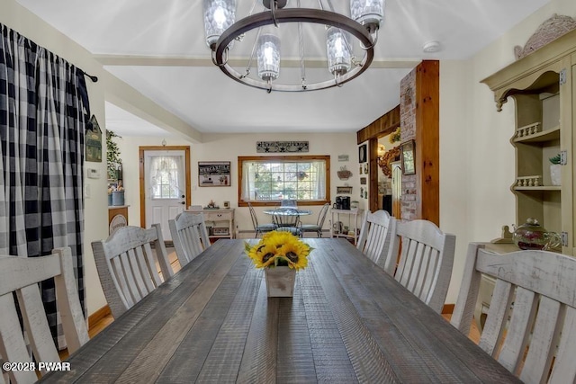 dining space with a notable chandelier