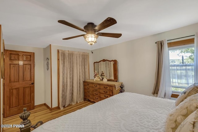 bedroom with ceiling fan and light hardwood / wood-style floors