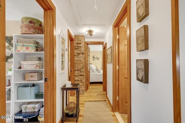 hall with light wood-type flooring