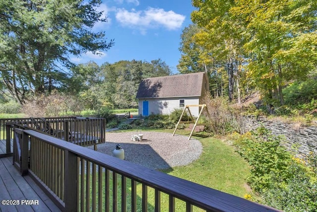 wooden terrace with a lawn