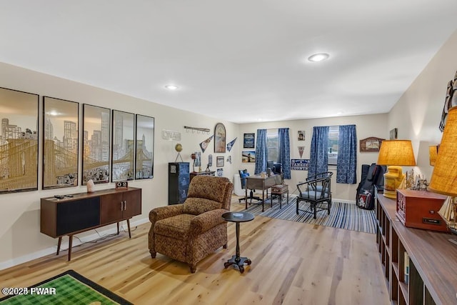 sitting room featuring light hardwood / wood-style flooring