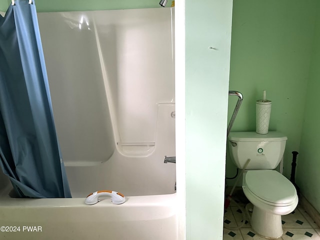 bathroom with tile patterned flooring and toilet