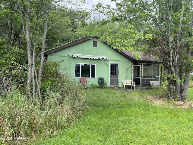 view of front of property with a sunroom