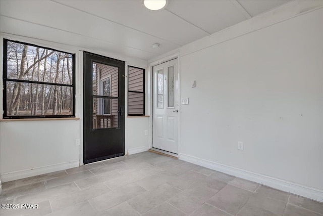 entryway featuring baseboards