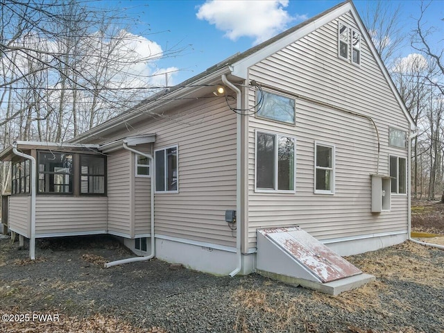 view of side of property with a sunroom