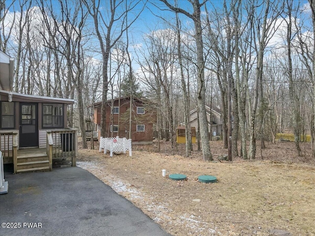 view of yard featuring a wooden deck