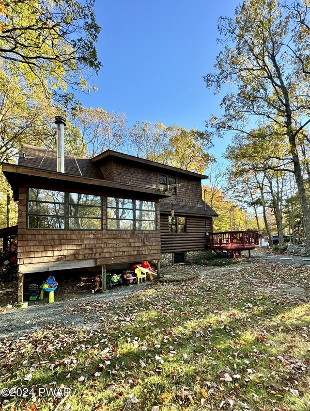 rear view of house with a deck