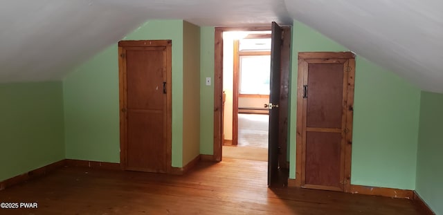 3307 Creamton Dr, Preston Park, PA 18455 - bonus room with a baseboard heating unit, vaulted ceiling, and hardwood / wood-style flooring
