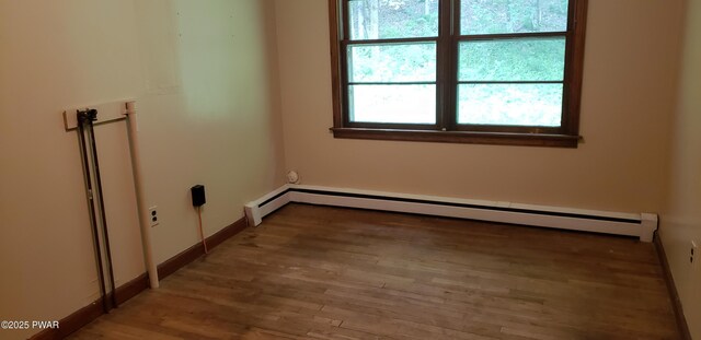 3307 Creamton Dr, Preston Park, PA 18455 - empty room featuring a baseboard radiator and wood finished floors