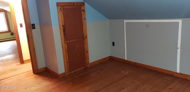 3307 Creamton Dr, Preston Park, PA 18455 - bonus room featuring light wood-style floors, a baseboard heating unit, and lofted ceiling