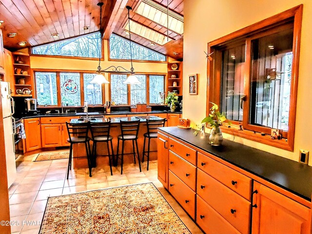 130 Willow Dr, Lords Valley, PA 18428 - kitchen featuring dark countertops, wooden ceiling, open shelves, and a sink