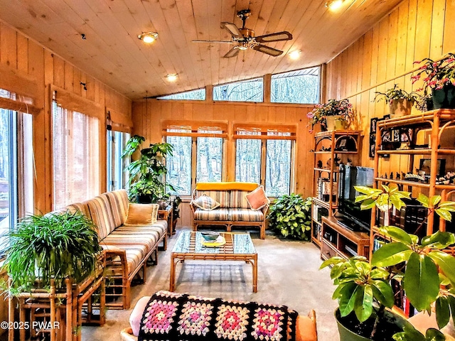 130 Willow Dr, Lords Valley, PA 18428 - living room featuring wooden walls, a wealth of natural light, a ceiling fan, and lofted ceiling