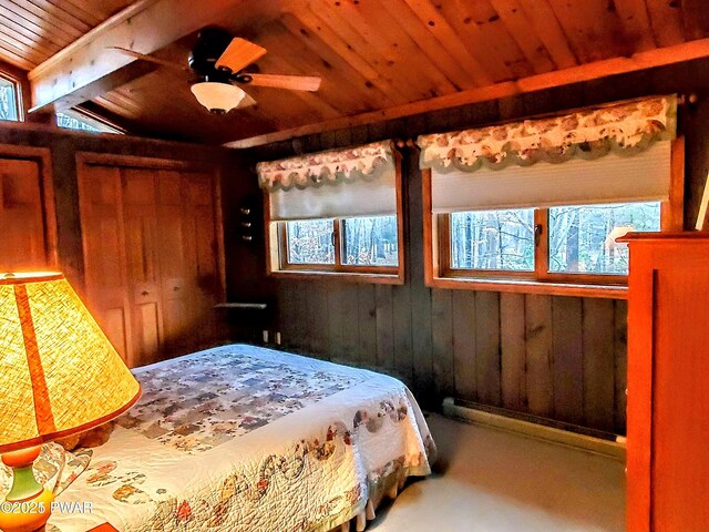 130 Willow Dr, Lords Valley, PA 18428 - bedroom with wooden walls, wooden ceiling, multiple windows, and concrete floors