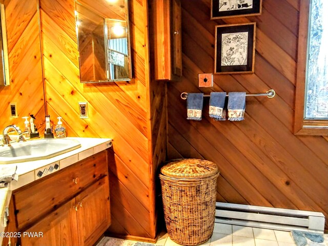 130 Willow Dr, Lords Valley, PA 18428 - bathroom featuring vanity, tile patterned flooring, baseboard heating, and wood walls
