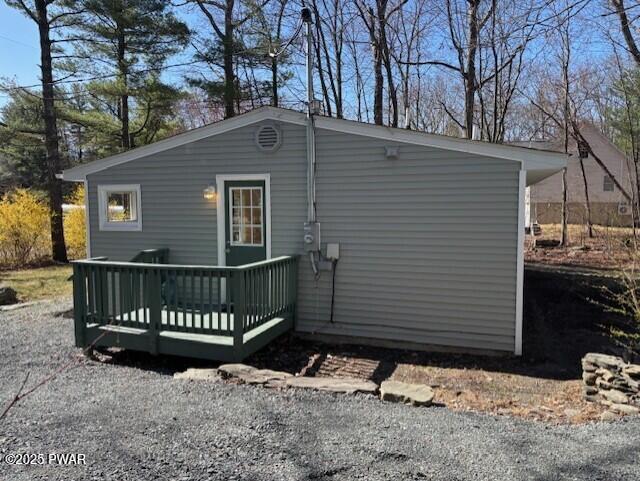 133 Arrowood Dr, Dingmans Ferry, PA 18328 - rear view of property with a deck