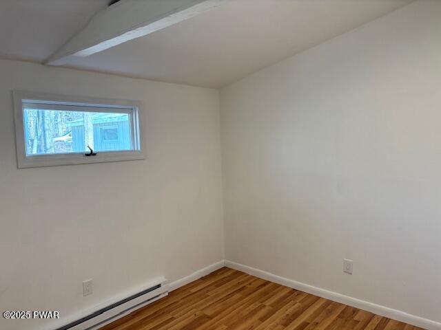 133 Arrowood Dr, Dingmans Ferry, PA 18328 - spare room featuring a baseboard radiator, wood finished floors, and baseboards