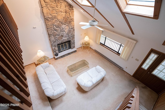 16 Par Ct, Lake Ariel, PA 18436 - living room featuring high vaulted ceiling, carpet, a fireplace, healthy amount of natural light, and a baseboard radiator